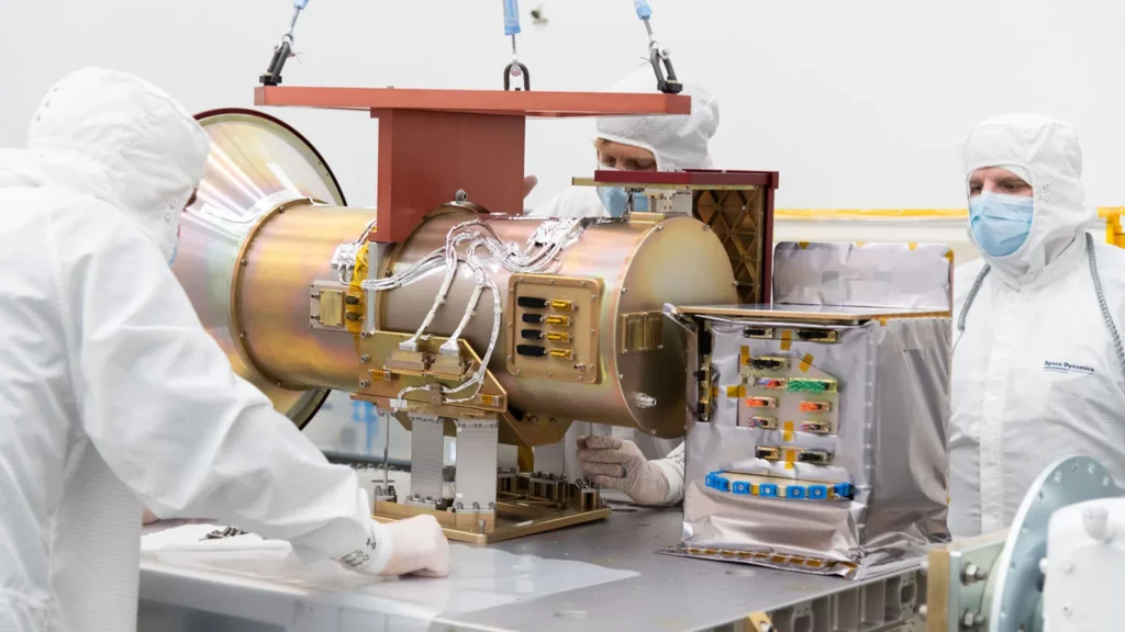 SDL Engineer and Scientist Brian Thompson, Engineering Associate Dave Griffin, and Mission Assurance Manager Russ Kirkham are pictured mounting the AWE Opto-Mechanical Assembly (OMA) to the flight EXPRESS Payload Adapter (ExPA) at SDL facilities on Utah State University’s Innovation Campus.